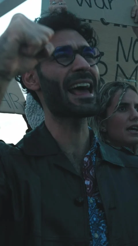Serious multiracial group demonstrating against the war and violence in the Stock Footage 262918647