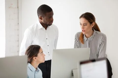 Serious multiracial team discussing solving business problem tog 스톡 사진