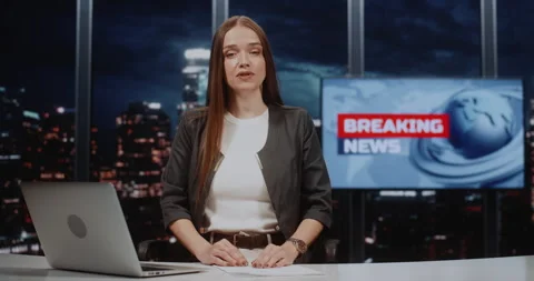 Serious News Presenter Reporting Live from Studio with Night City Background and 스톡 동영상 332468555