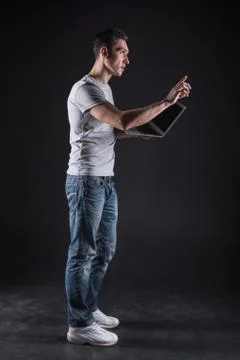 Serious professional programmer working with computer devices Stock Photos