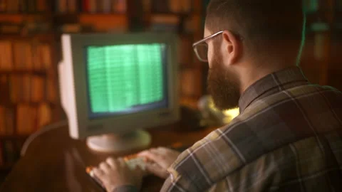 Serious programmer coding software in 90s office, hacking process, security Stock Footage 213980848