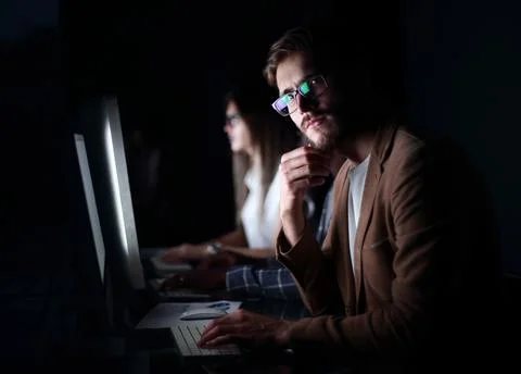 Serious programmer looking at the computer screen 스톡 사진
