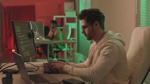 Serious Programmer Working in Office Stock Footage 165218987
