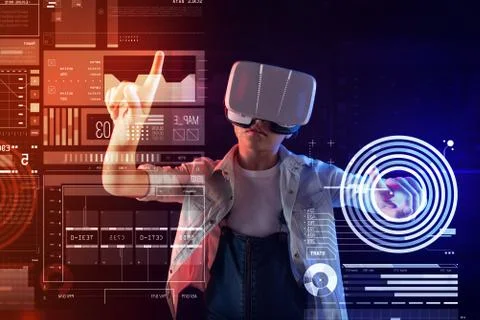Serious progressive girl using virtual reality while studying Foto stock