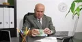 Serious Sales Agent Thinking Concerned Count Cash Disappointed Wealth Concept 4k or 4k+ Resolution