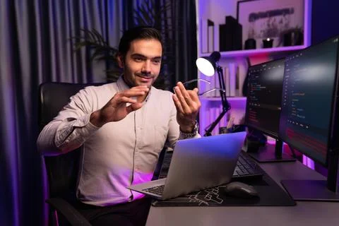 Serious smart IT developer meeting via application team record laptop. Surmise. Stockfoto's
