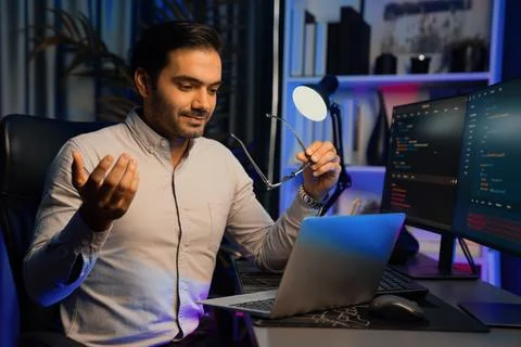 Serious smart IT developer meeting via application team record laptop. Surmise. Stock Photos