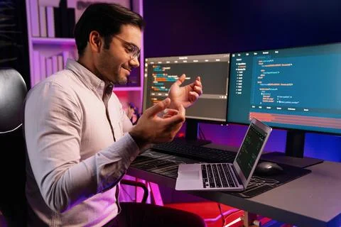 Serious smart IT developer meeting via application team record laptop. Surmise. Foto stock