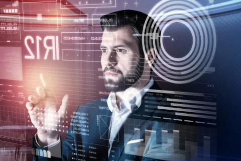 Serious software developer frowning while looking at the screen Foto stock