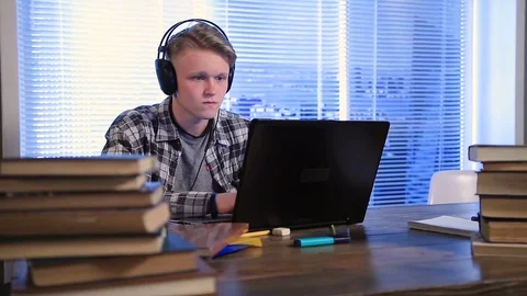 Serious student e-learning online with laptop Stock Footage 72273865