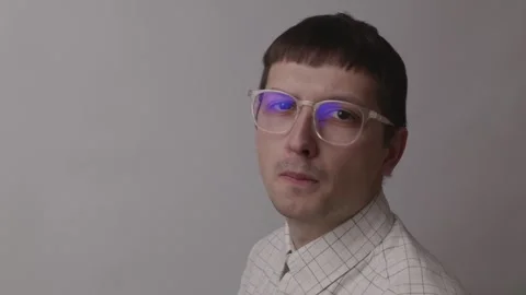 Serious tech specialist turning face to camera with focused look Stock Footage 335143502
