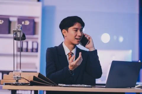 Serious trader using mobile phone app on smartphone for checking stock trad.. 스톡 사진
