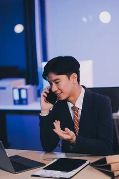Serious trader using mobile phone app on smartphone for checking stock trad.. Stock Photos