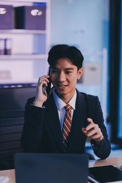 Serious trader using mobile phone app on smartphone for checking stock trad.. 스톡 사진