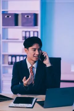 Serious trader using mobile phone app on smartphone for checking stock trad.. 스톡 사진