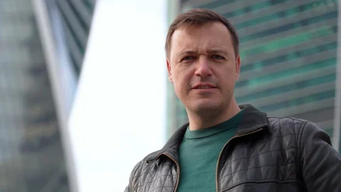 Serious upset man in black jacket showing x sign crossed arms portrait on urban Stock Footage 167820934