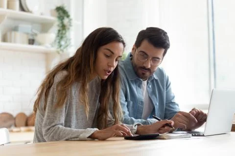 Serious wife and husband planning budget, checking finances Stock Photos