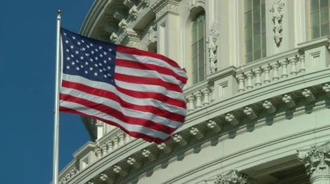 Serious wind, US flag, Capitol building close, stock footage Stock Footage 29674908