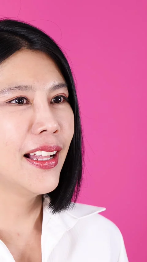 Serious Woman Explaining With Gestures Against Pink Background Stock Footage 329598650