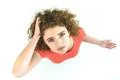 The serious woman stand on the white background. View from above Photo