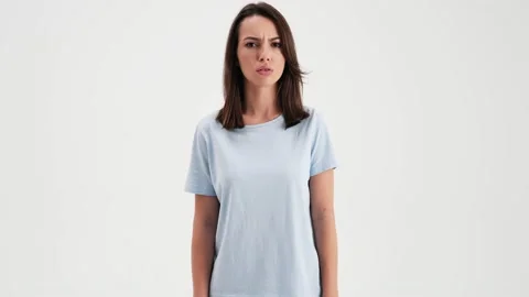 A serious woman wearing basic t-shirt is shaking her head negatively Stock Footage 157866977