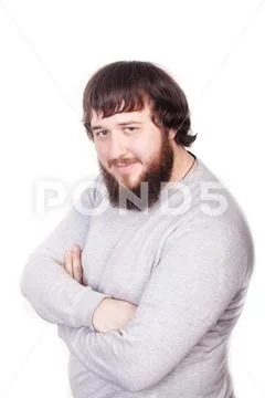 Serious young and attractive businessman in grey jumper with his hands crossed Stock Photos