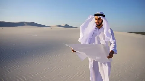 Serious young Arabian UAE Sheikh businessman considering construction plan Stock Footage