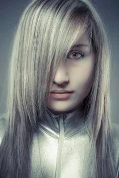 Serious young blond, concept future and modernity, girl with sweet face Stock Photos