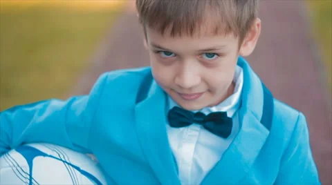 Serious Young Boy in Blue Looking at Camera Stock Footage 68804495