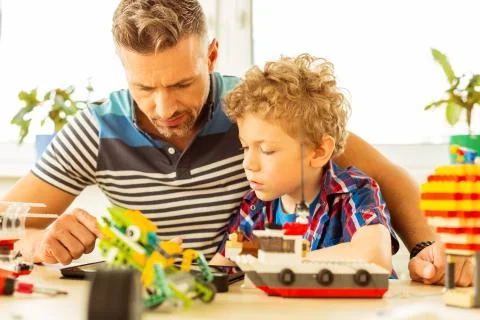 Serious young boy watching a tutorial video Foto stock