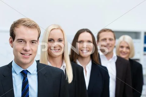 Serious young business manager with his team Stock Photos