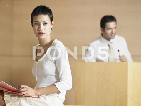 Serious Young Businesswoman In Presentation Room Stock Photos