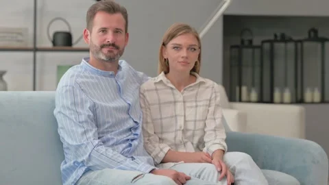 Serious Young Couple Looking at Camera at Home Stock Footage 287894310