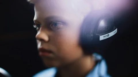 Serious young handsome singer boy writing song in the studio male music mic Stock Footage 98216751