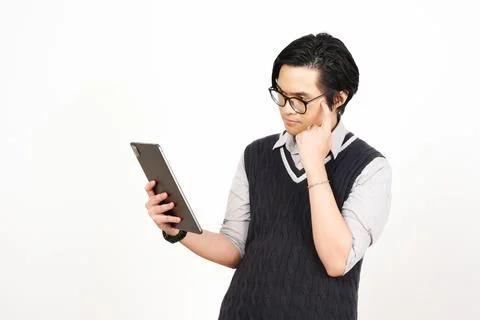 Serious Young Man Analyzing Data on Digital Tablet Stock Photos