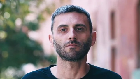 Serious young man looking at camera portrait Stock Footage 275140587