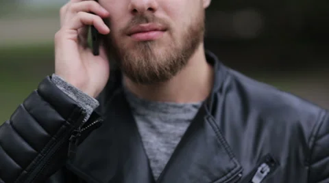 Serious young man trying to make a call Stock Footage 63469612