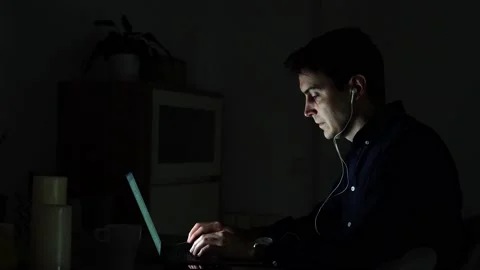 Serious young millennial man remote working while typing on laptop at home Stock Footage 145492968