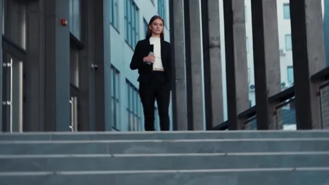 Serious young smart female office manager entrepreneur businesswoman downstairs Stock Footage 137667341