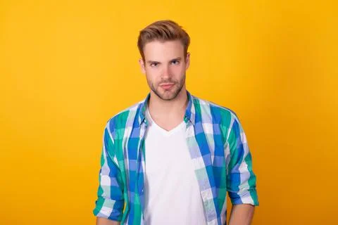 Seriously handsome. Regular guy portrait. Handsome guy yellow background. Young Stock Photos