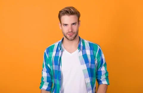 Seriously handsome. Regular guy portrait. Handsome guy yellow background. Young Stock Photos