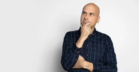 Seropis man looking up while thinking Stock Photos