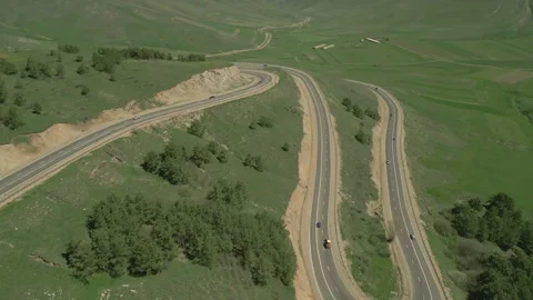 Serpentine between the hills in Lori Oblast in Armenia. Highway, cars, mountains Stock Footage 252899374