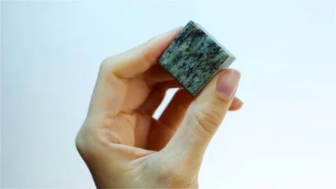 Serpentine marble. Jeweler holding Marble with serpentine. Stock Footage
