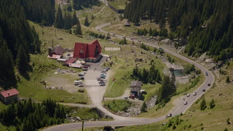 Serpentine in the mountains with settlements at the bottom of them. Stock Footage 295866082