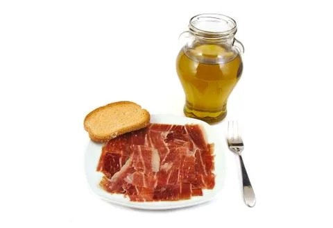 Serrano ham, bread and extra virgin olive oil. Jabugo. Mediterranean diet Stock Photos