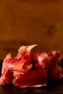 Serrano ham chips on a plate. Stock Photos