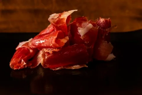 Serrano ham chips on a plate. Stock Photos