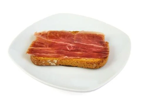 Serrano ham whith bread. Spanish tapa. Mediterranean diet Stock Photos