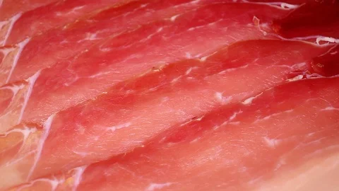Serrano prosciutto dry cured ham red beef meat slices italian crudo cotto Stock-Footage 98793694